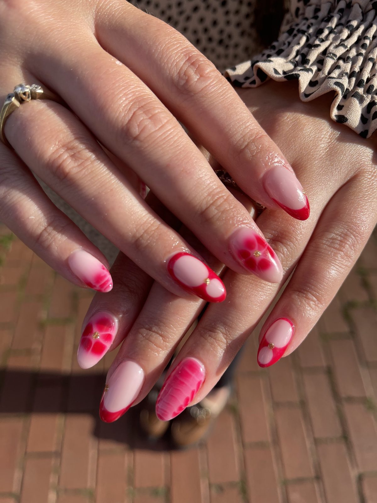 Pink almond nails with red heart and marble art