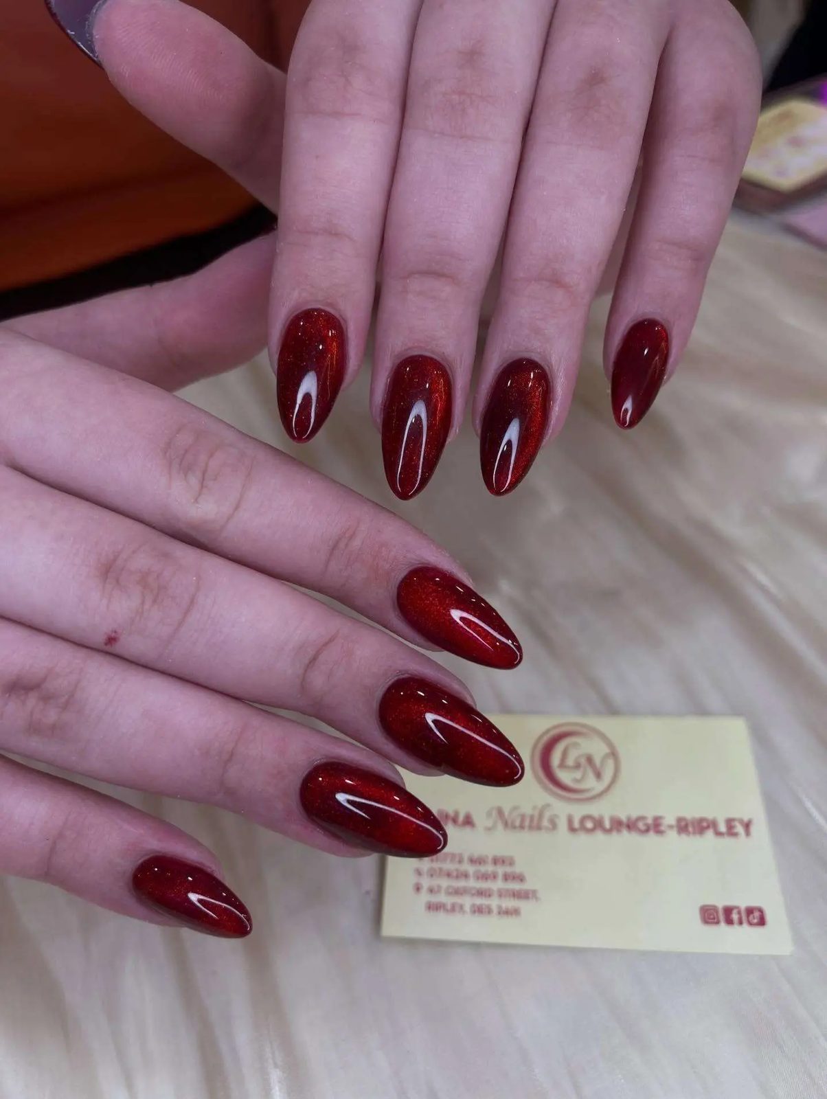 Deep red chrome almond nails