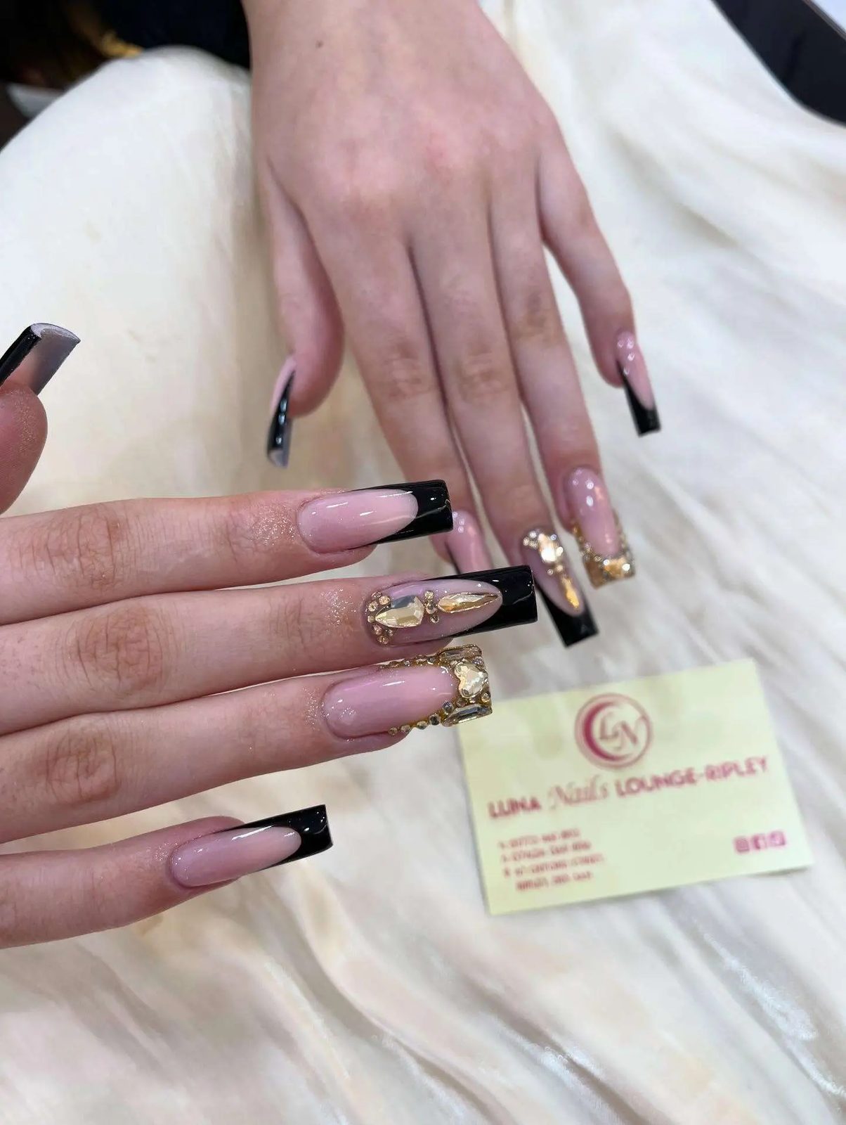Black French tips with gold charms